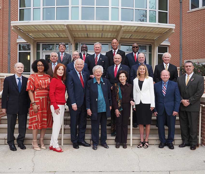P鈥媔鈥媍tured from the left:  Honorary Trustee Abe Mitchell with Trustees Dr. Steve Furr; Dr. Scott Charlton; Ron Jenkins; Chandra Brown Stewart; Jimmy Shumock; Jim Yance; Ken Simon - Chair pro tempore; Ron Graham; Governor Kay Ivey - ex officio President and Chair鈥�; Dr. Steve Stokes; Tom Corcoran; Lenus Perkins; Arlene Mitchell; Mike Windom; Alexis Atkins and Margie Tuckson; and President Tony Waldrop.